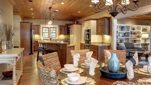 a kitchen and dining room with a table and chairs at Blue Ridge Lake Retreat - Lakefront Luxury Home - Private Dock, Hot Tub, Sundeck, Private Boat Launch, Near Downtown - Blue Ridg in Blue Ridge