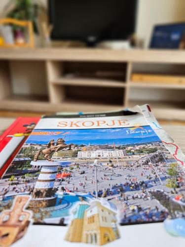 a magazine sitting on top of a table at Fantazy Apartment Main Square in Skopje