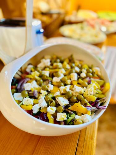 a bowl of salad with peas and cheese on a table at Pokoje Gościnne Góraleczka in Szaflary