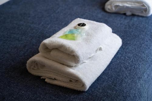 a pile of white towels sitting on top of a table at Perfectly located central Chester town house -2BR in Chester