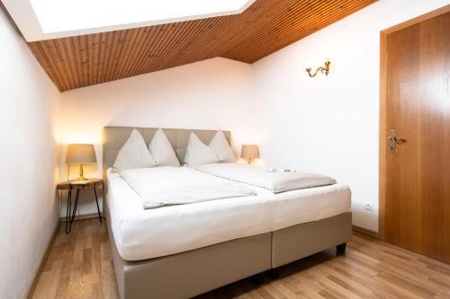 Postel nebo postele na pokoji v ubytování Pesentheinerhof