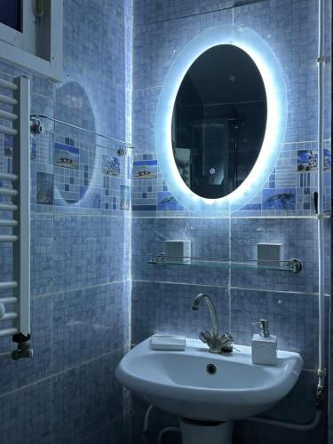 a bathroom with a sink and a mirror at Dar El Rezk in Tunis