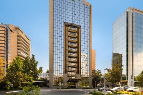 a tall building with a lot of windows at Wyndham Garden Santiago Kennedy in Santiago