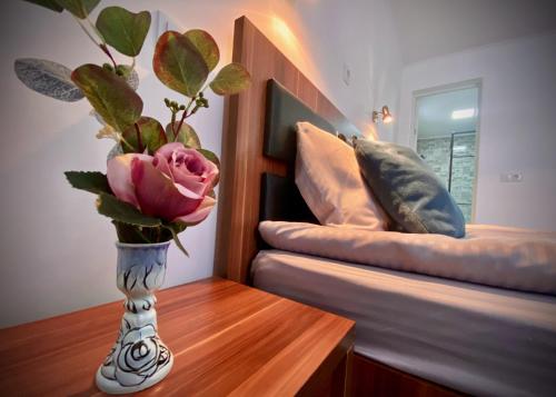 En eller flere senge i et værelse på AMIS Apartment