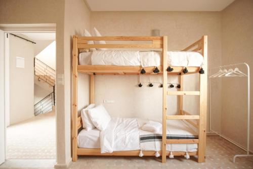 a bunk bed room with two bunk beds at The Line Up in Mirleft