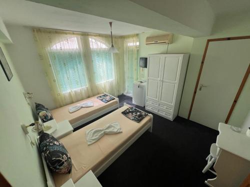 Postel nebo postele na pokoji v ubytování Guesthouse Flora