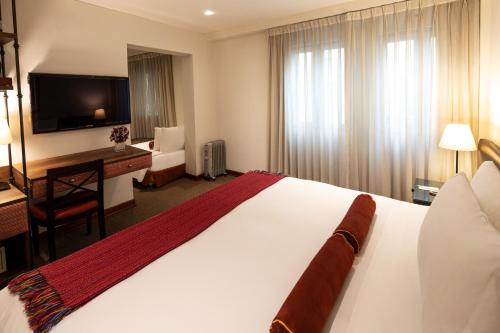 Katil atau katil-katil dalam bilik di LP Los Portales Hotel Cusco