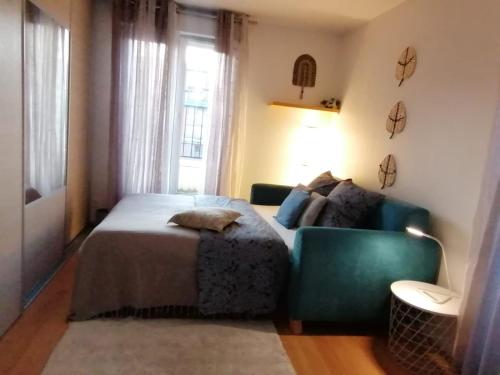 Ένα ή περισσότερα κρεβάτια σε δωμάτιο στο Olympe Stade de France