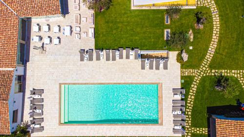 an overhead view of a swimming pool in a yard at La Corte Di Pulicinu in Baja Sardinia
