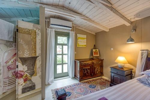 a bedroom with a bed and a dresser and a window at Villa Menta 2 2445 in Malinska