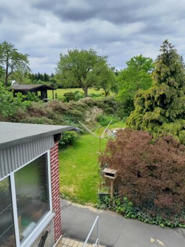 an aerial view of a yard with a house at Haus Sonnenschein in Trogen