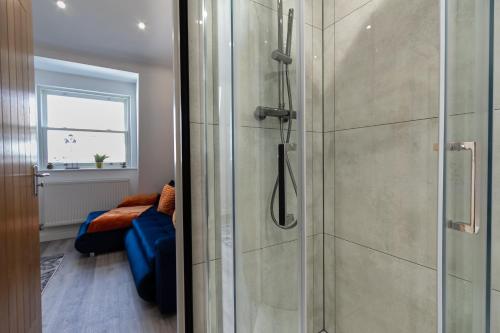 a shower with a glass door in a bathroom at The Lanes Luxury - Rose Platinum Properties in Brighton & Hove