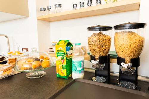 a kitchen counter with two containers filled with food at B&B Bagni di sole in Campo San Martino