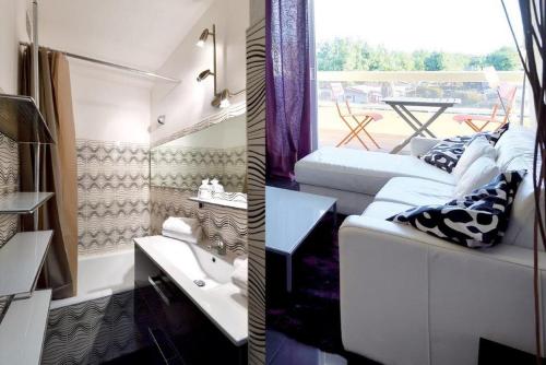 un salon avec un canapé et une table dans l'établissement Studio MAYA - Héliopolis L 84 - Chic - 2 personnes, au Cap d'Agde