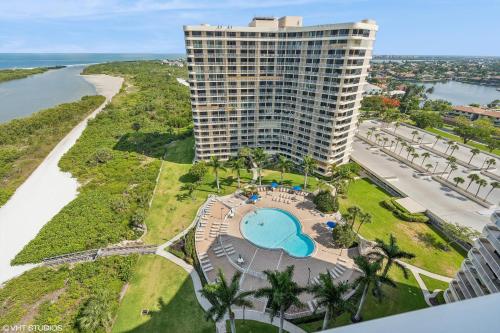 an aerial view of a tall building with a pool at Seaview on Marco in Marco Island
