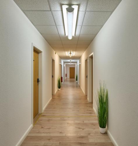 an empty corridor of an office building with a corridorngthngthngthngthngthngth at sleep1c in Hamburg