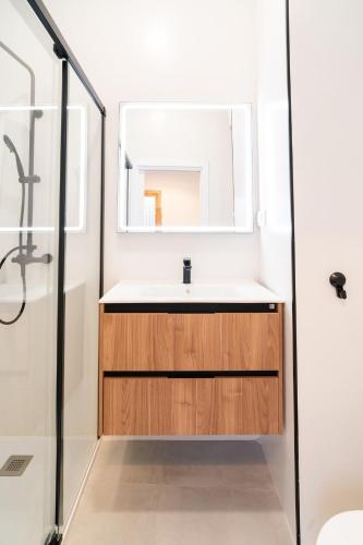 a bathroom with a sink and a shower at Cos del Bou - Unik Vacation in Tarragona