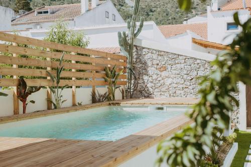 a swimming pool on the roof of a house at Ti Noémia - casa de vila in Minde