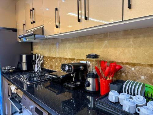 a kitchen counter with a coffee maker on it at Elite Holiday Home - Luxury & Centric Flat in Tangier
