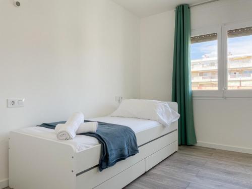Postel nebo postele na pokoji v ubytování Palm Beach by Unik Tarragona
