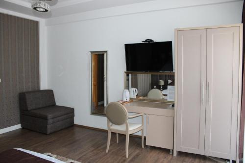 TV a/nebo společenská místnost v ubytování Hotel Cleon