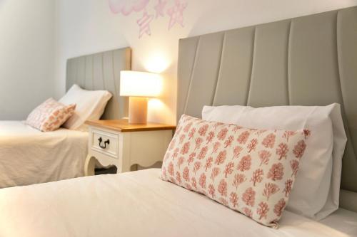 a bedroom with a bed with a pillow on it at LC Las Armas in Zaragoza