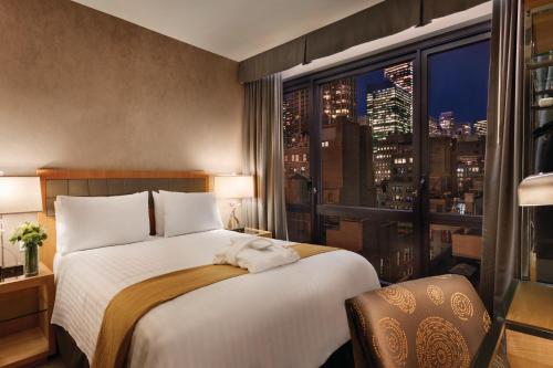 Katil atau katil-katil dalam bilik di Executive Hotel Le Soleil New York