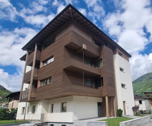 an apartment building with a wooden facade at Villa Miryam in Ponte di Legno