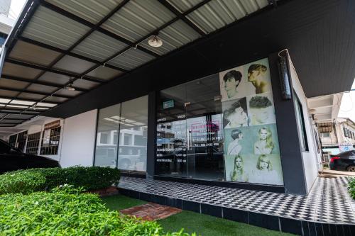 a store front with a large display window at River Hotel The Budget in Nakhon Pathom