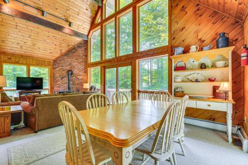 a dining room with a wooden table and chairs at Family-Friendly Ludlow Cabin on Lake Pauline! in Ludlow