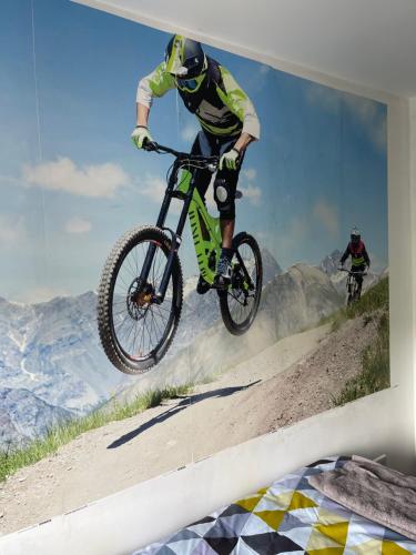 a man doing a trick on a bike in the air at Bike Park View in Merthyr Tydfil