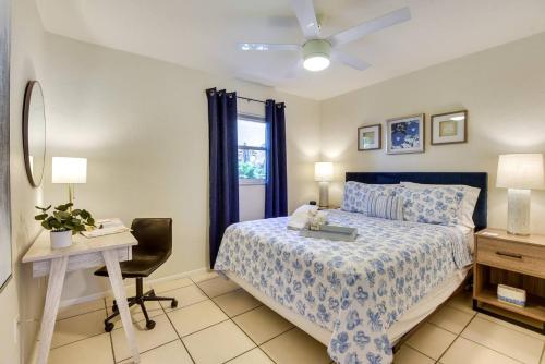 a bedroom with a bed and a desk and a window at Coconut Cove Mid-long term stays available Walk to Downtown Trolly to BEACHES in Sarasota