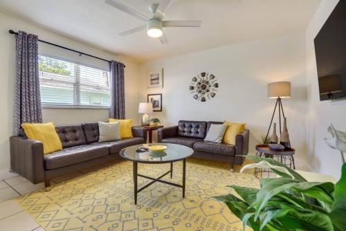 a living room with a couch and a table at Coconut Cove Mid-long term stays available Walk to Downtown Trolly to BEACHES in Sarasota