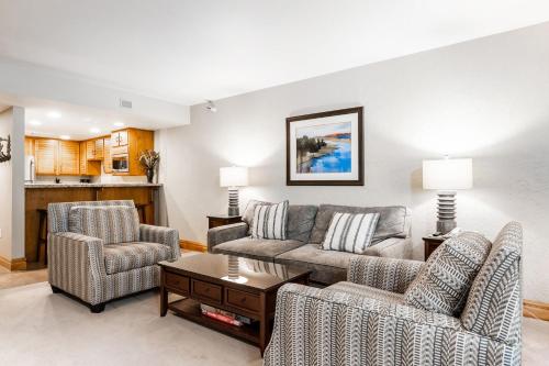 a living room with a couch and two chairs at Silver King by All Seasons Resort Lodging in Park City