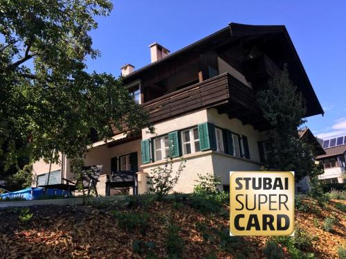 a house with a super card sign in front of it at Ansitz Hofer in Fulpmes