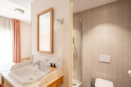 a bathroom with a sink and a mirror at Villa Camille Hotel & Spa in Banyuls-sur-Mer