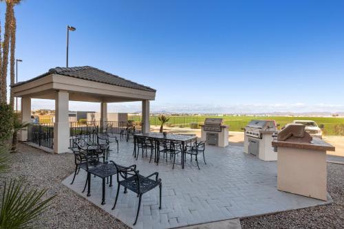 a patio with tables and chairs and a gazebo at Candlewood Suites Yuma by IHG in Yuma