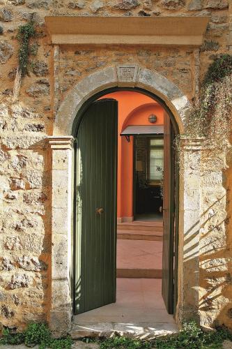 an entrance to a building with a green door at The Captain's House Boutique Hotel in Preveza