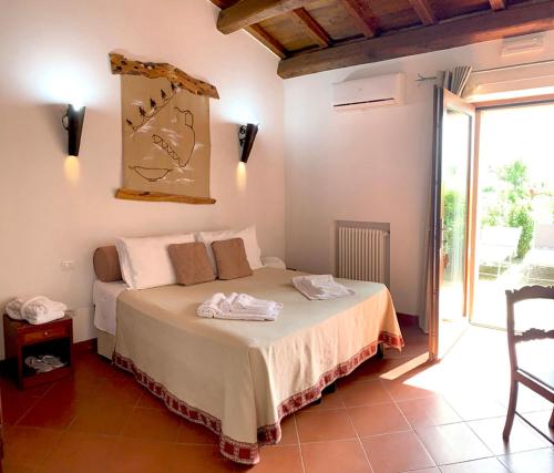 Postel nebo postele na pokoji v ubytování Resort Fonte Vulci