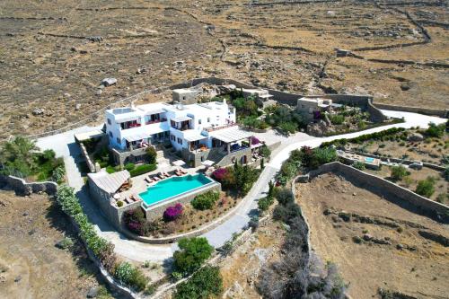 an aerial view of a house with a swimming pool at VILLA NAUTILIA - Luxury Suites and Cottages in Kalafatis