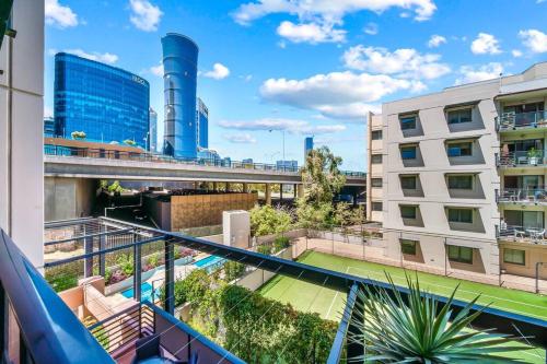 a balcony with a view of a building at Perth city BNB l CBD and Pool view - 1xKing bed and 2xSingle beds in Perth