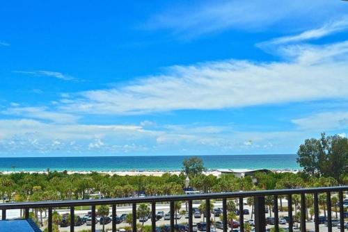 a view of a parking lot and the ocean at Our House at the Beach 604E By Beachside Management in Siesta Key
