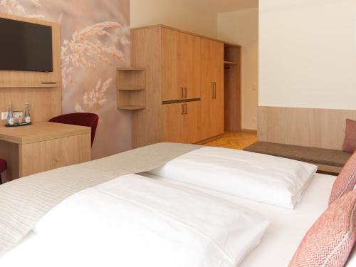 Postel nebo postele na pokoji v ubytování Hotel Wübbel