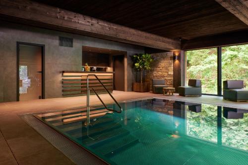 a swimming pool in a house at Hotel Singer in Ludvíkov