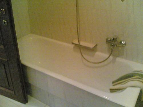 a bath tub in a bathroom with a sink at Bed&Breakfast Giardino Agritourist in Controguerra