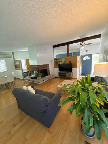 a living room with a couch and a tv at Entire Home 3 bds 2 bats in Seattle