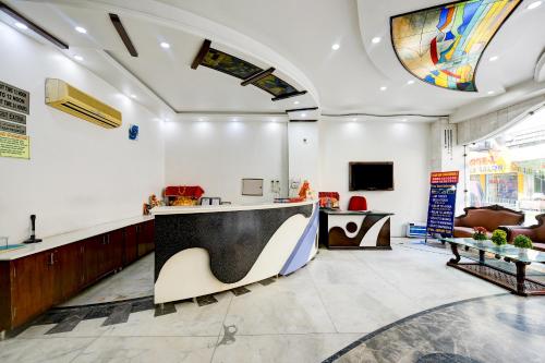 a lobby with a reception desk in a building at Hotel Legend International -Just a min walk from New Delhi Railway Station in New Delhi