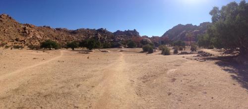 a dirt road in the middle of a desert at Maison d'hôtes afoulki tafraout in Tafraoute