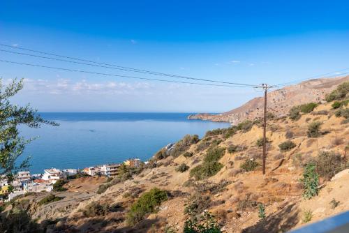 a view of the ocean from a hill at Evelyn Villa Crete in Tsoútsouros