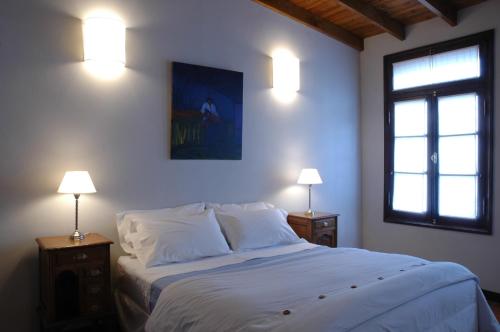 En eller flere senge i et værelse på Posada Gotan
